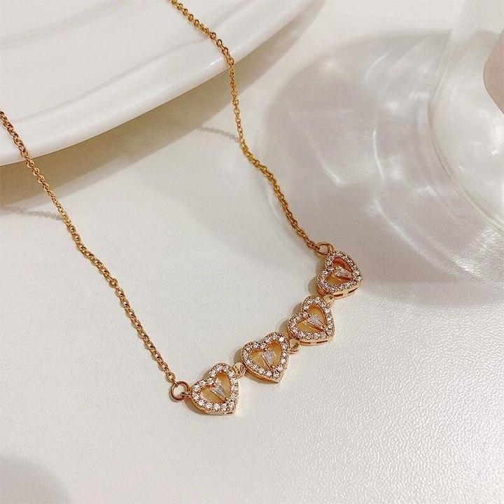 MAGNETIC FOUR HEART NECKLACE